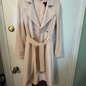 Light pink sheath dress with matching belted coat.